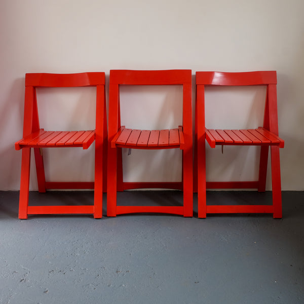 Three Aldo Jacober Red Folding Chairs